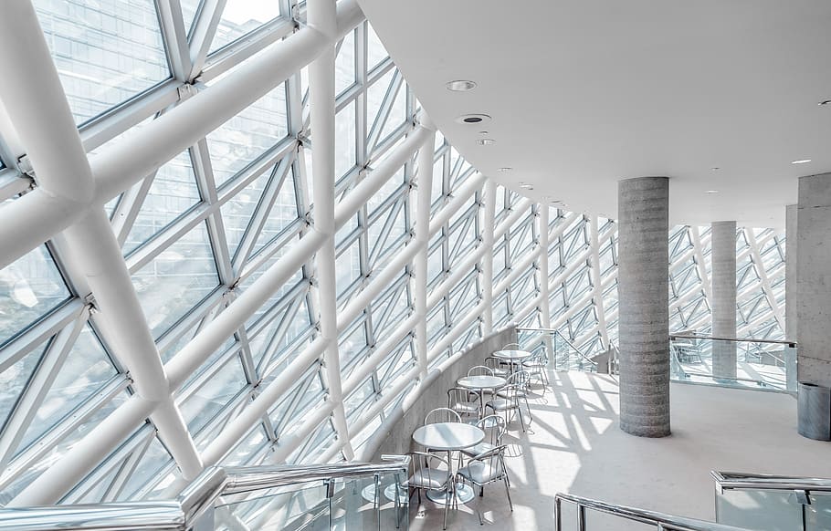 white concrete building with chairs, white metal framed glass window building HD wallpaper