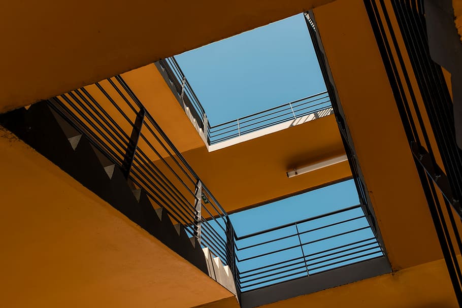 bottom view of concrete building, birds eye view of staircase HD wallpaper