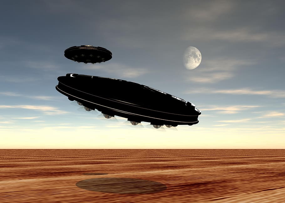 black UFO discs flying above desert photo, flying saucer, alien