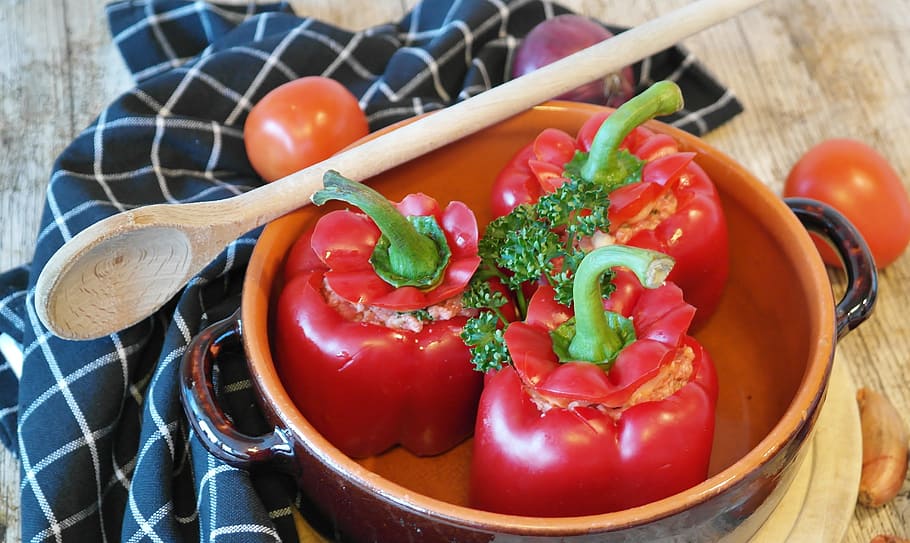three red bell peppers in bowl with wooden spoon on table, papria HD wallpaper