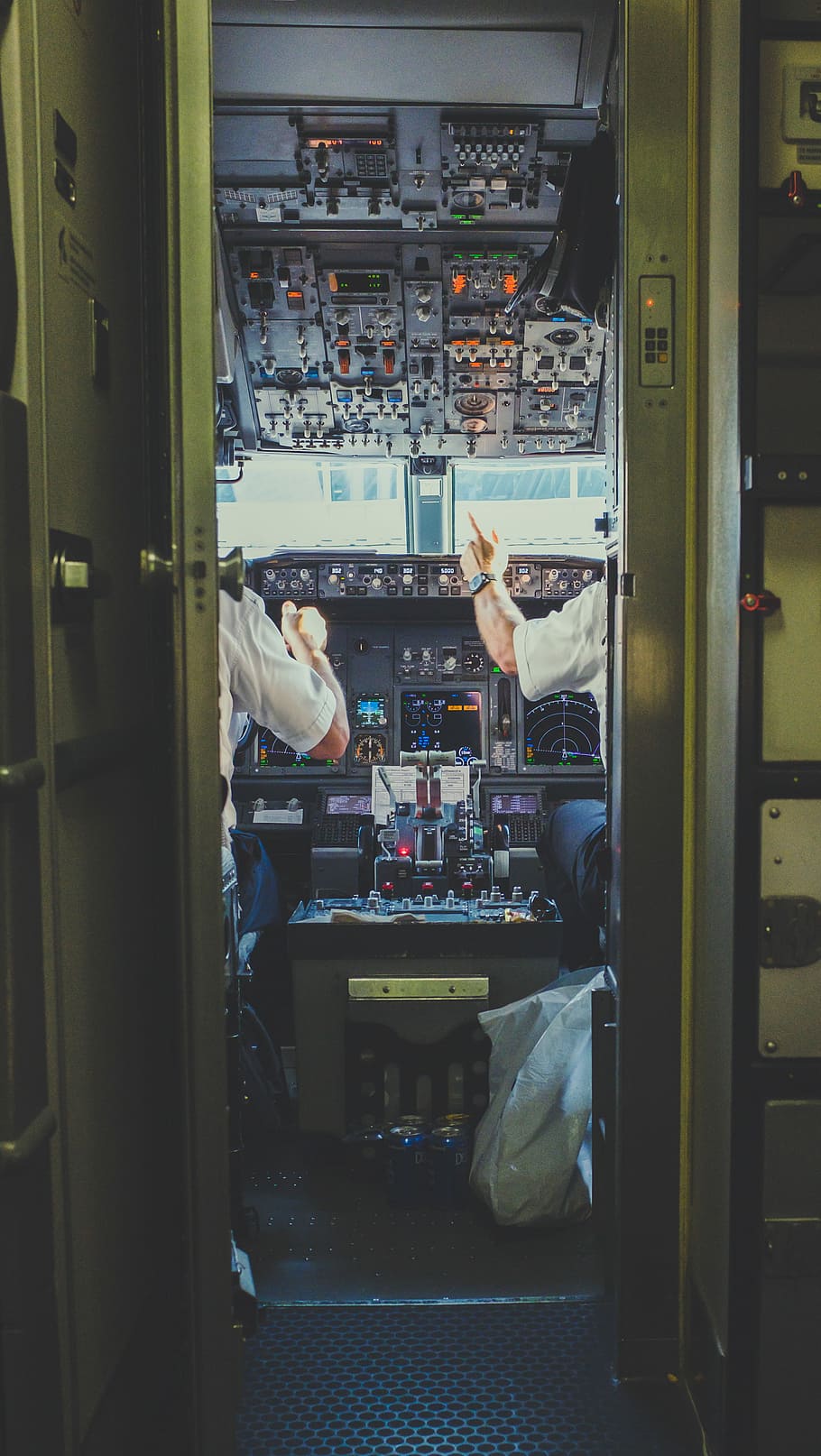 pilot and copilot inside plane cockpit, two pilot inside plane