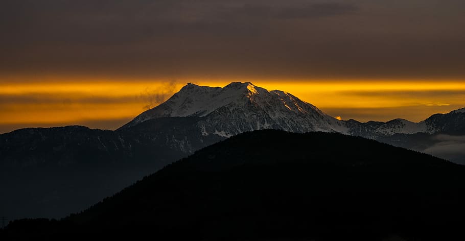 aerial view of mountain cover snow, silhouette of mountain with mountain range view during golden time HD wallpaper