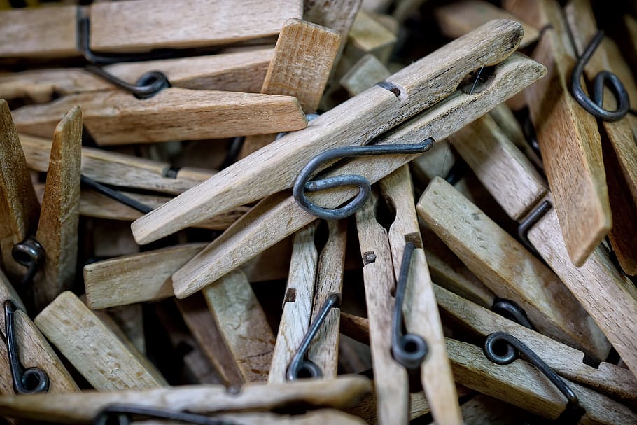 selective focus photography of brown wooden clothes pin lot HD wallpaper