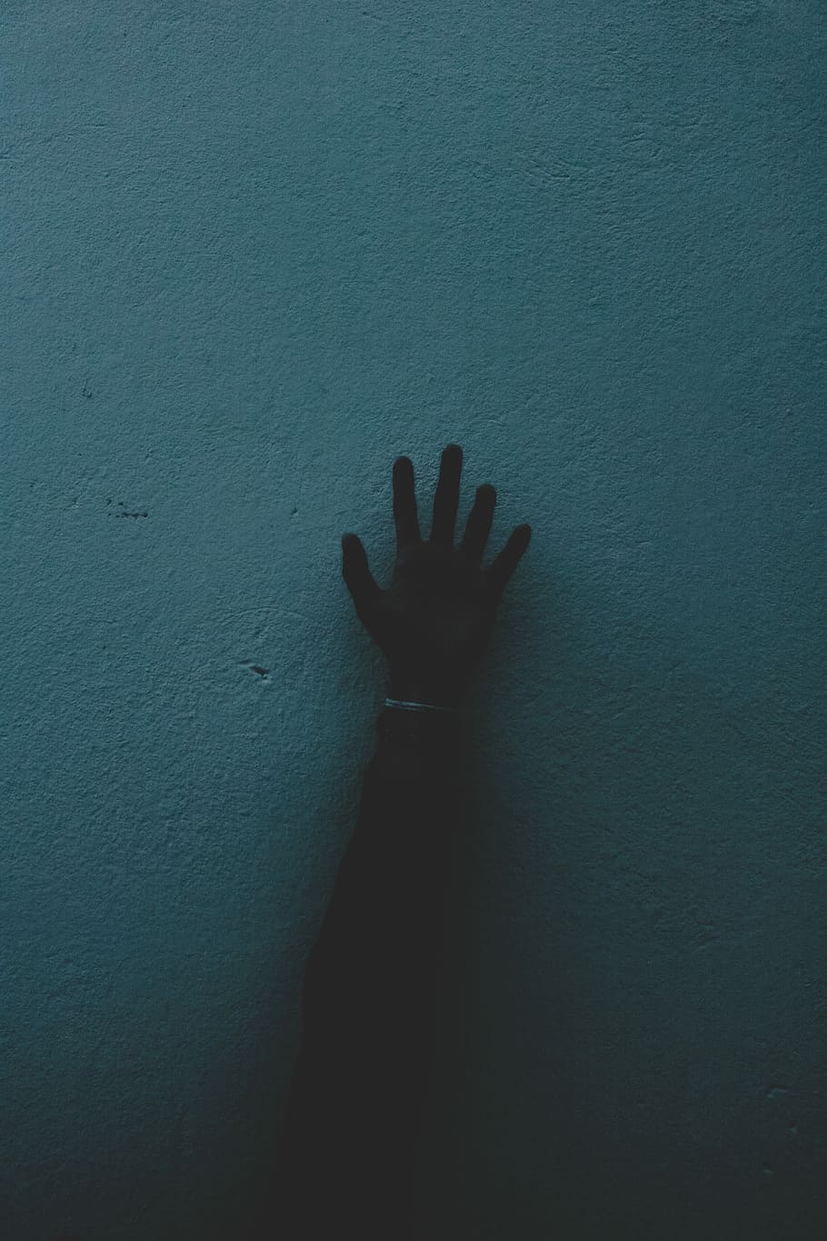right human hand painting on green concrete wall, person's right hand touching blue wall HD wallpaper