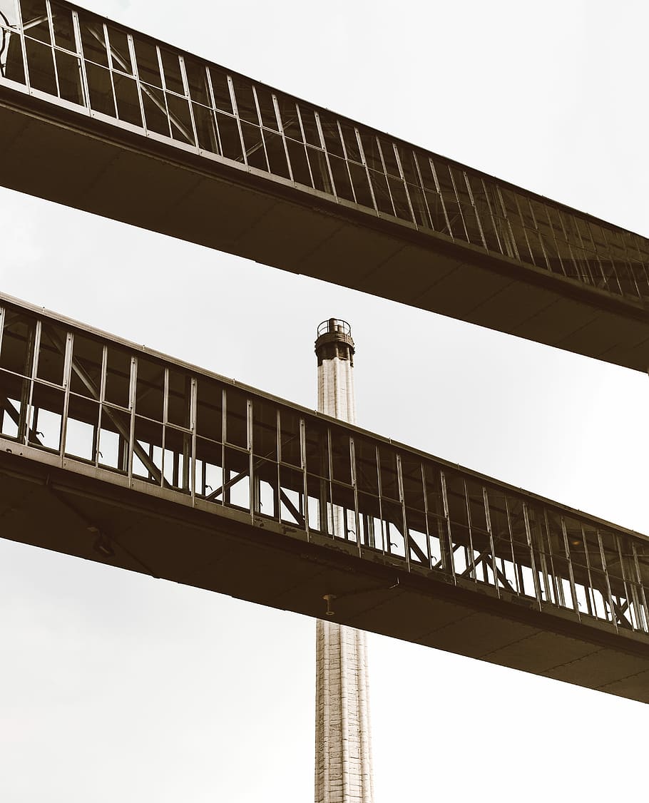 white tower behind two foot bridges, brown tower near foot bridge HD wallpaper