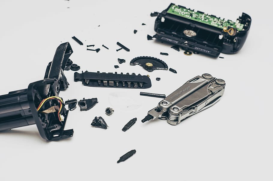 broken black device beside gray multitool, silver, middle, components HD wallpaper