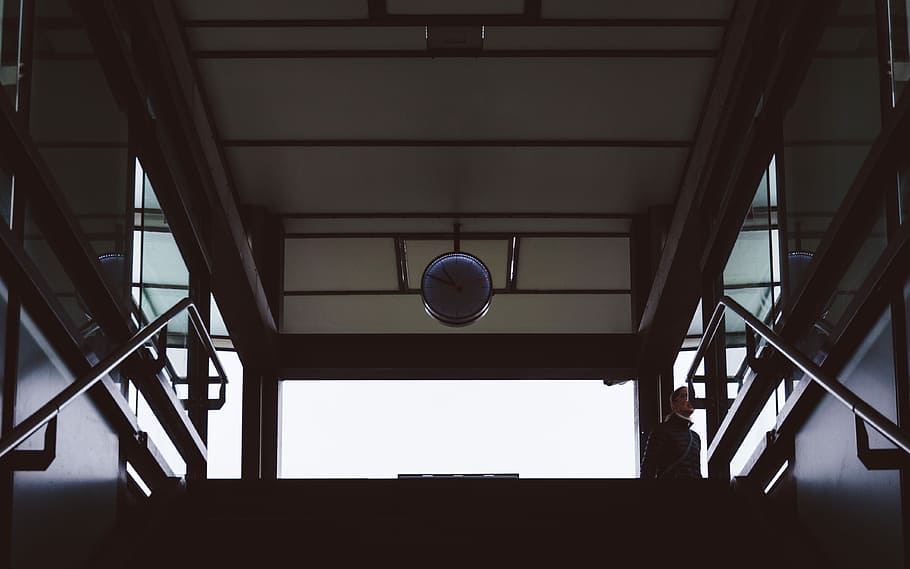 low angle photography of stair, gray analog clock mounted on ceiling HD wallpaper