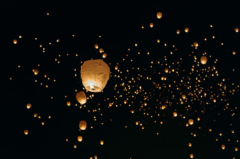 low-angle shot of paper lanterns, beige sky lanterns floating in the dark night sky HD wallpaper