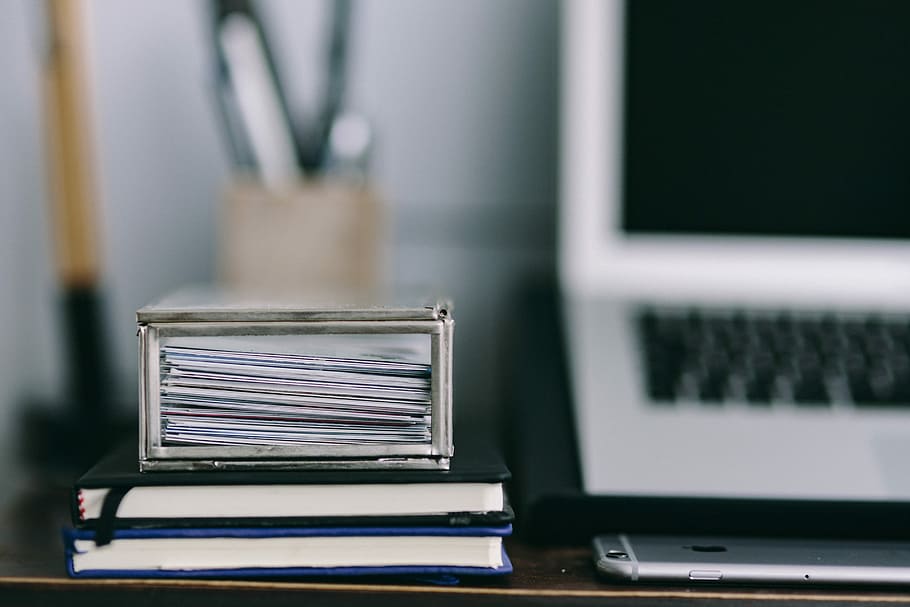 Elegant workspace with Macbook, iPhone, business cards and notebooks HD wallpaper