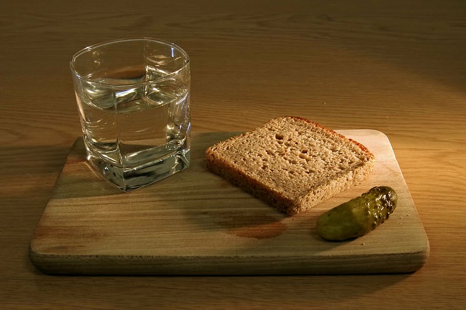 clear glass cup with water beside loaf bread on wooden board HD wallpaper