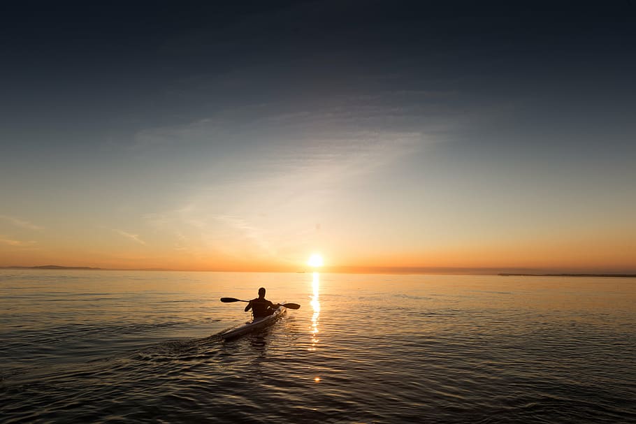 person riding on kayak, paddle, explore, ocean, sky, water, reflection