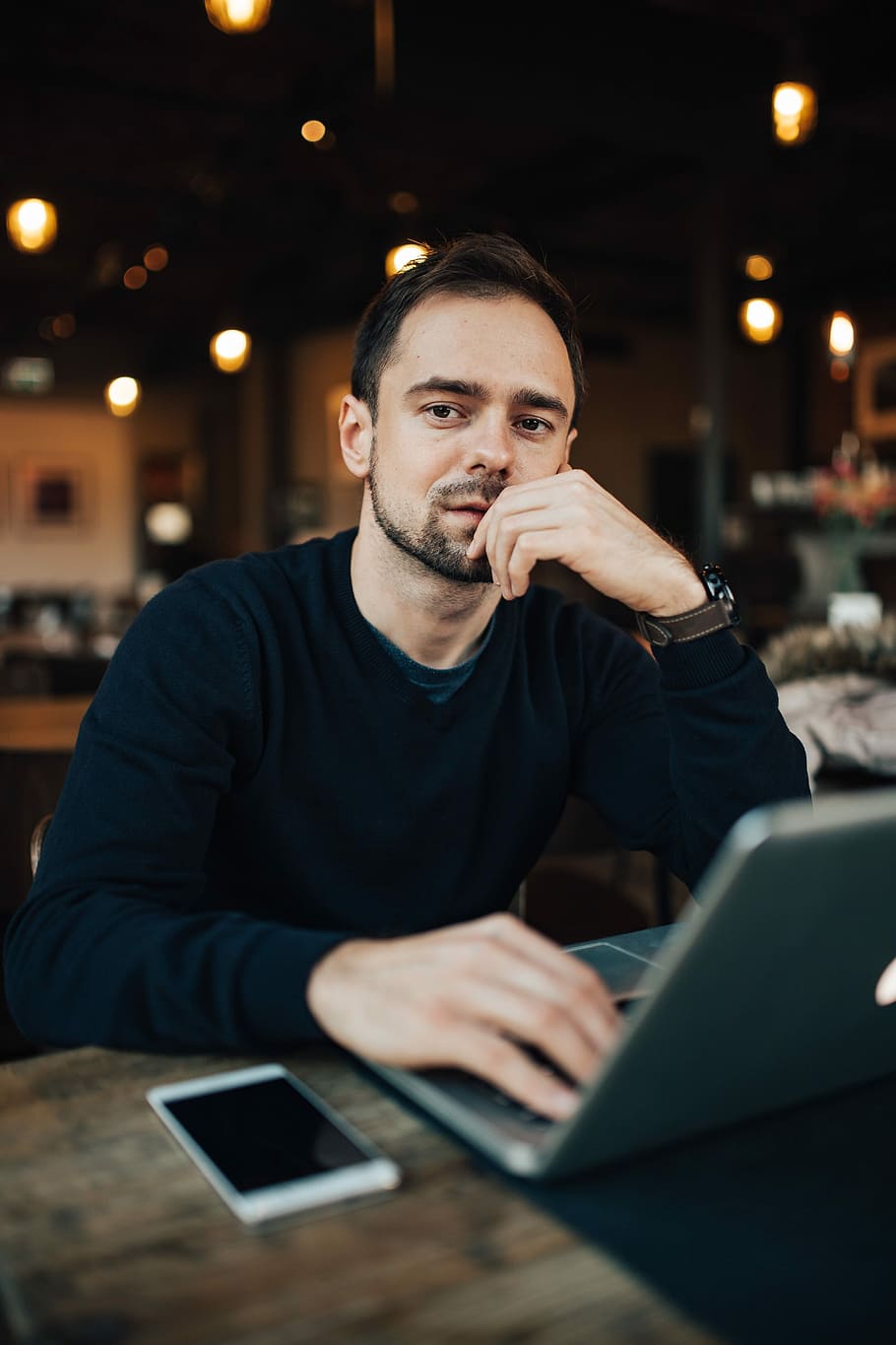 Young Entrepreneur Working from a Modern Cafe, interior, workspace HD wallpaper