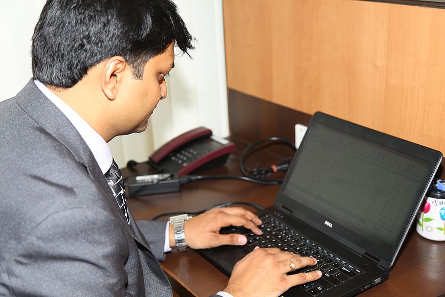 man sitting in front of laptop computer, executive, business HD wallpaper
