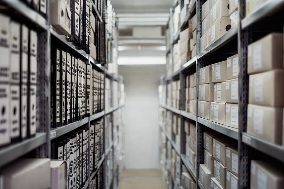 selective focus photography of gray metal rack with boxes, archive HD wallpaper