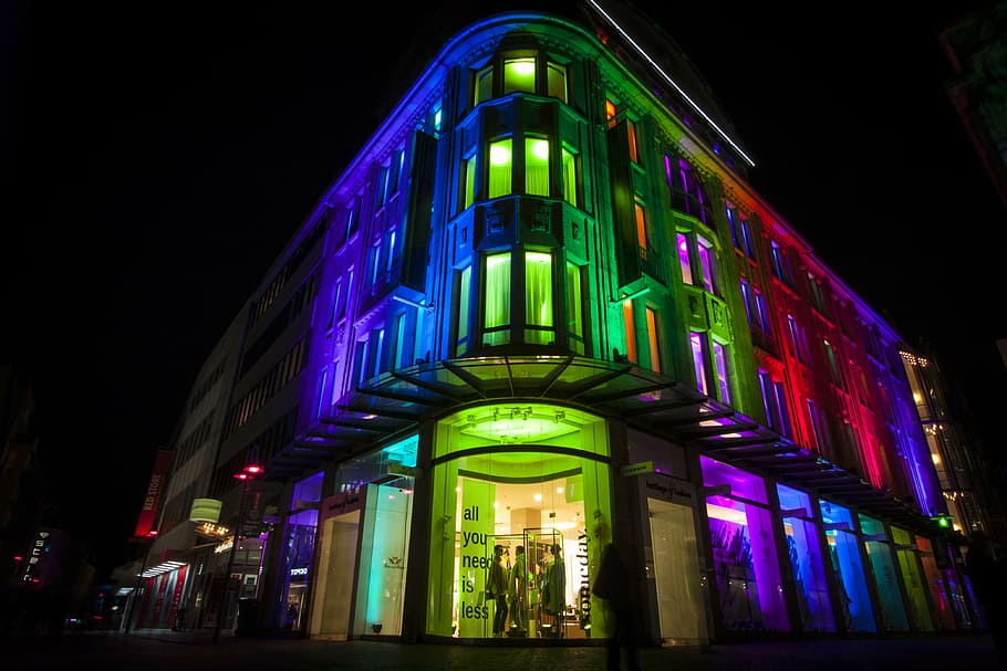 concrete building with assorted lights at night time, led, illuminated HD wallpaper
