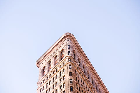 low-angle photo of concrete building, bottom shot photography of brown concrete building HD wallpaper