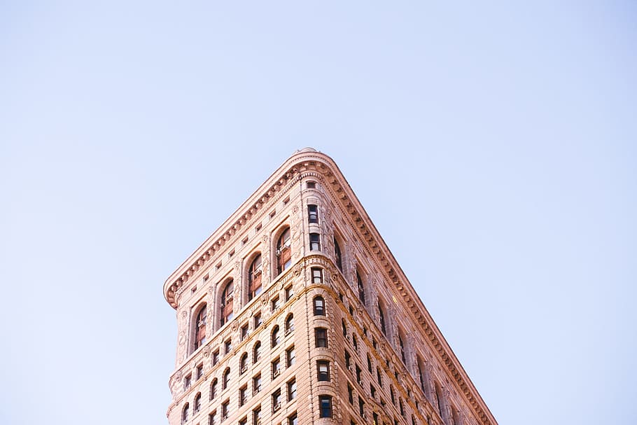 low-angle photo of concrete building, bottom shot photography of brown concrete building HD wallpaper