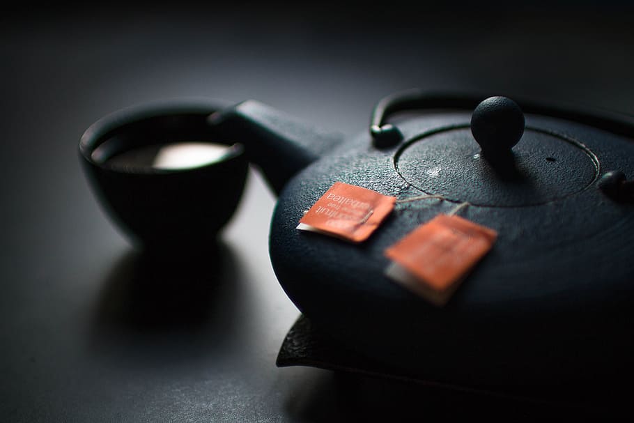 selective photography of a teapot and a teacup, black ceramic teapot HD wallpaper