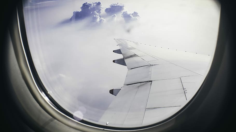 architectural photography of plane's wing above clouds during flight, airplane flying at daytime HD wallpaper