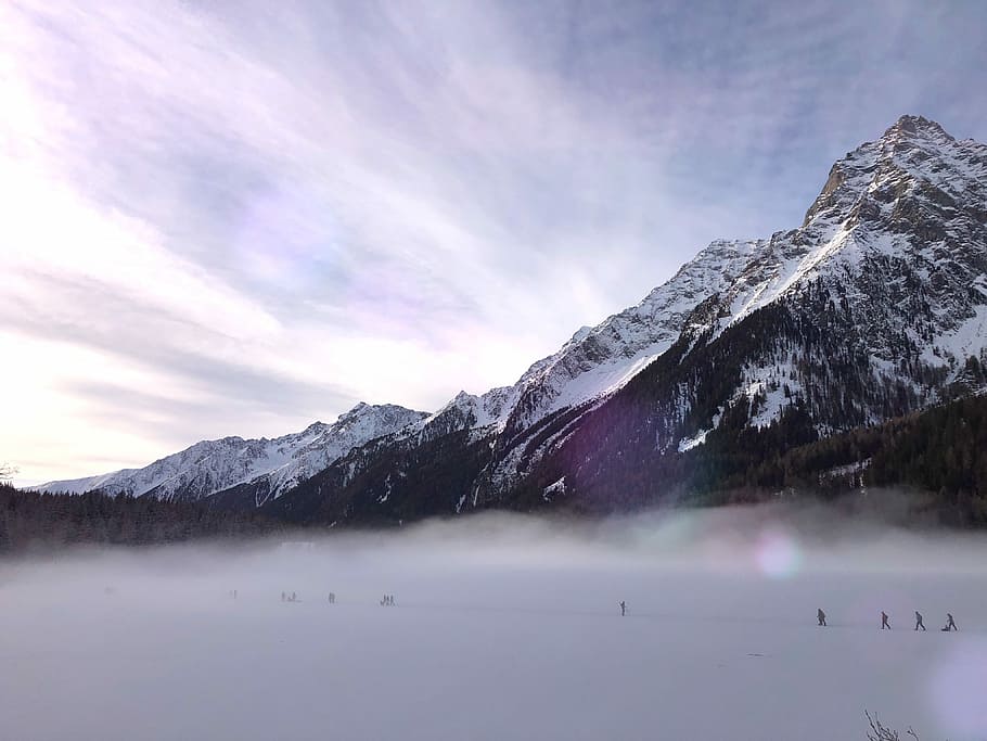 people hiking on snow covered field near glacier mountain during day, people walking on snow field HD wallpaper