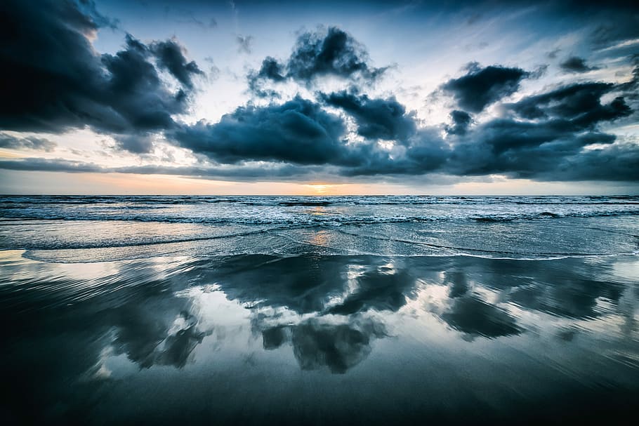 photo of seawaters and gray clouds, reflection of cloudy sky during day time HD wallpaper