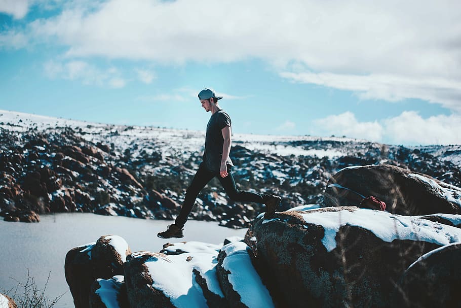 man walking on the rocks, man about to walk on stone, portrait HD wallpaper
