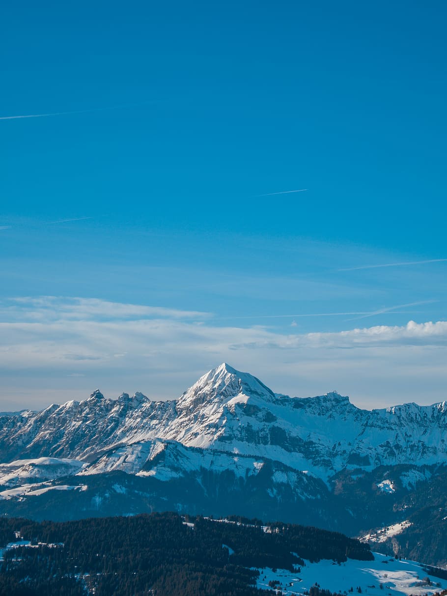 aerial view of mountain covered with snow, aerial photography of glacier mountain under blue sky at daytime HD wallpaper