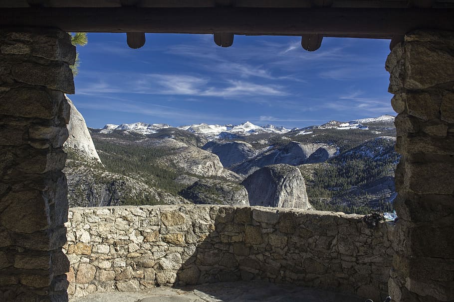 mountains viewed from brown bricked window, empty gray brick balcony HD wallpaper