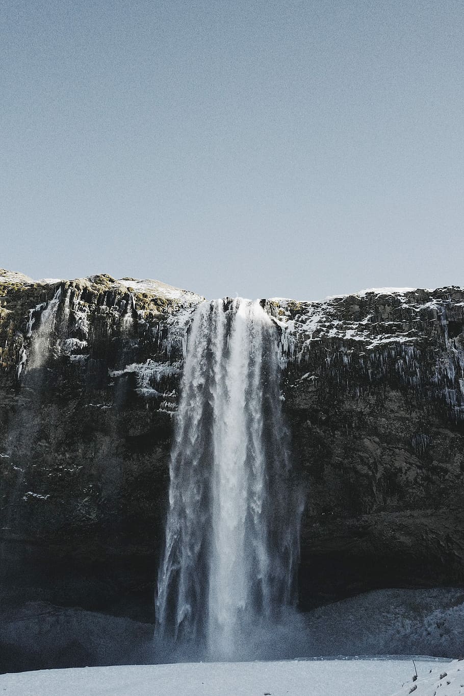 waterfall under blue sky, waterfall during daytime, rock face HD wallpaper