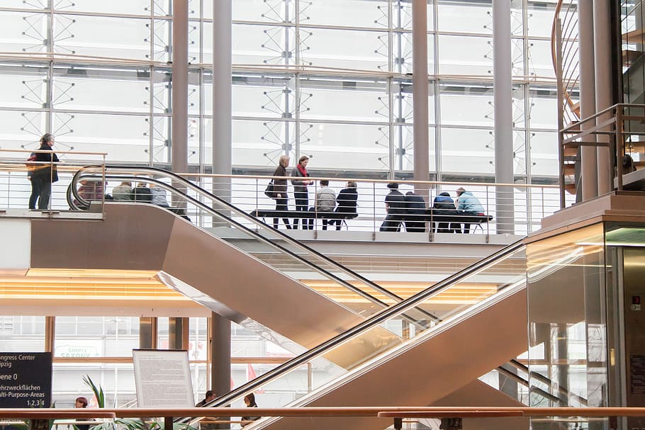 people standin beside railings near escalator, elevator, human HD wallpaper