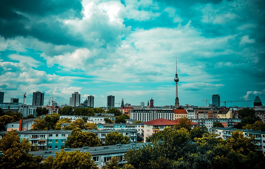 high rise building under white clouds at daytime, berlin, tv tower