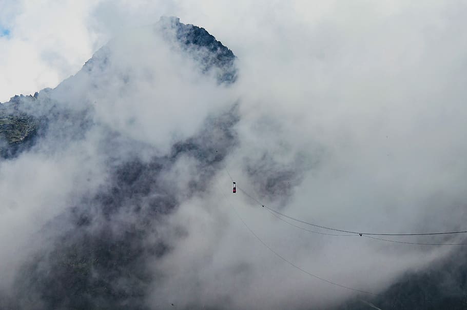 mountain view under cloudy sky during day time, mountain covered with clouds HD wallpaper