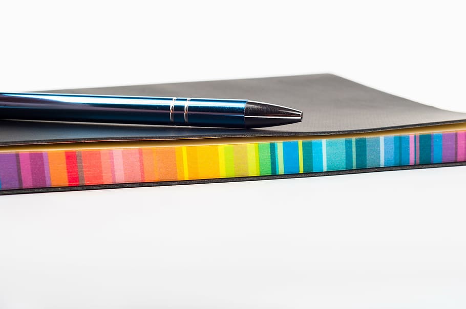 black ball-point pen and notebook, colorful, school, stationary