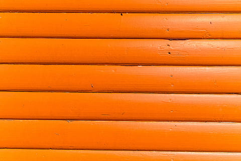 Close-up texture shot of bright orange wood panels. Image captured with a Canon DSLR HD wallpaper