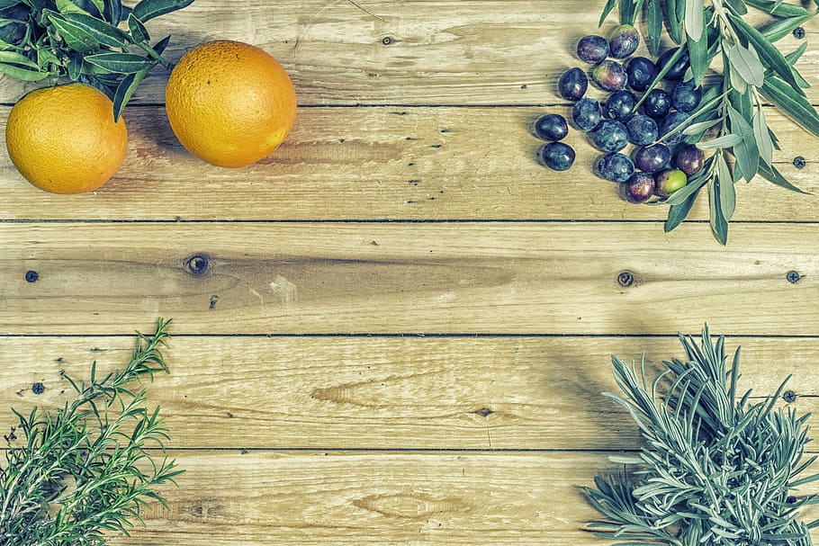 round orange fruit near green leaf, food, condiments, oil, olives