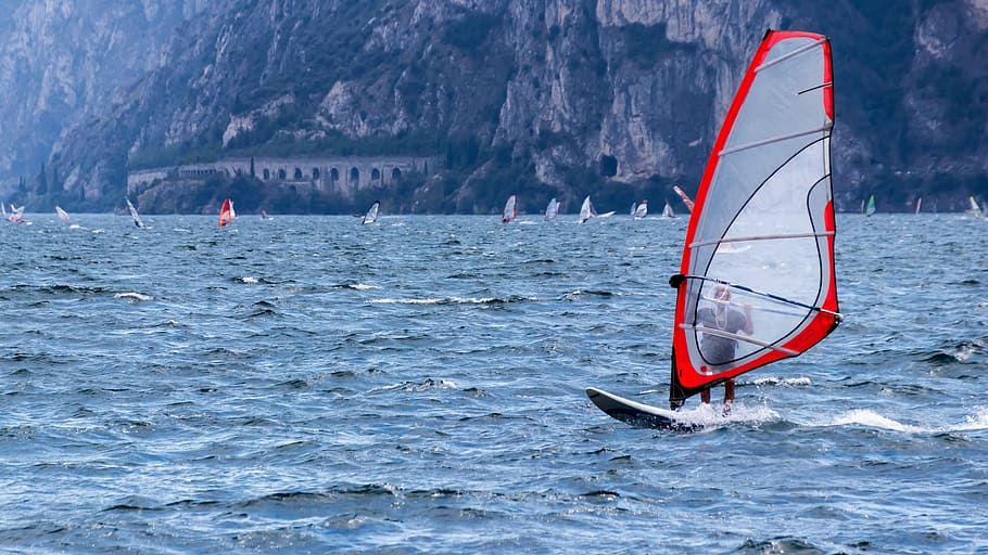 man riding sailboat at daytime, wind surfing, water, holiday HD wallpaper