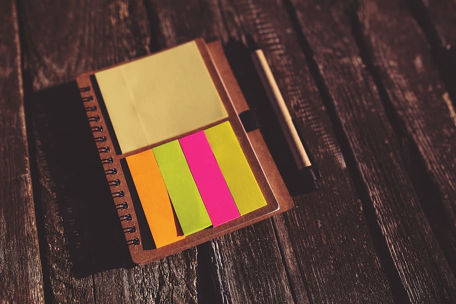 yellow, pink, and orange sticky notes on brown notebook, reminder HD wallpaper