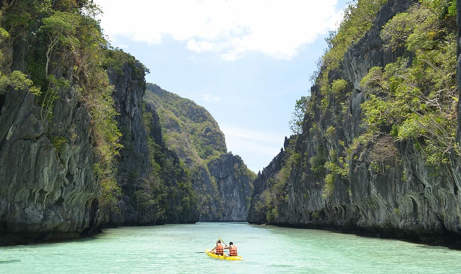 two men wearing life vest on boat, two person kayaking in the water HD wallpaper