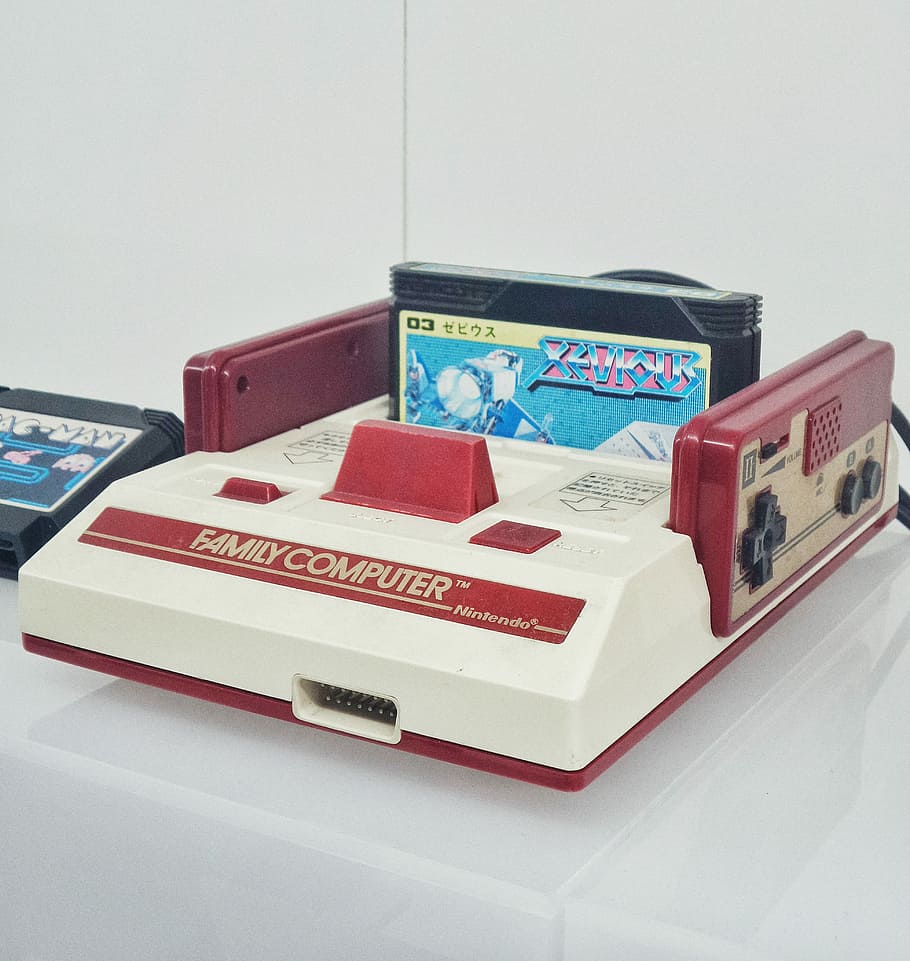 red and white Nintendo Family Computer console, red and white Family Computer with game cartridge on table, HD wallpaper