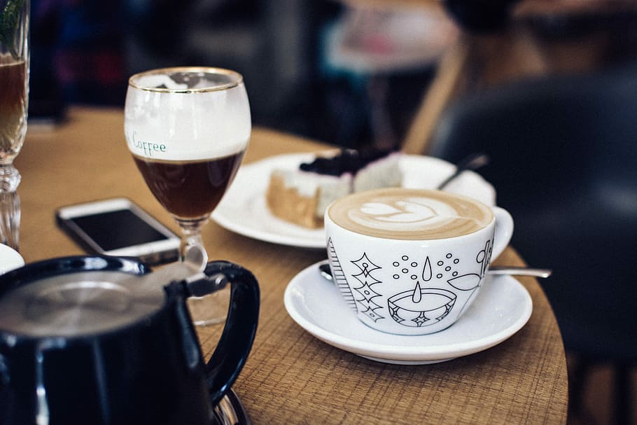 Cappuccino with latté art on a table, café, coffee, drink, cup HD wallpaper