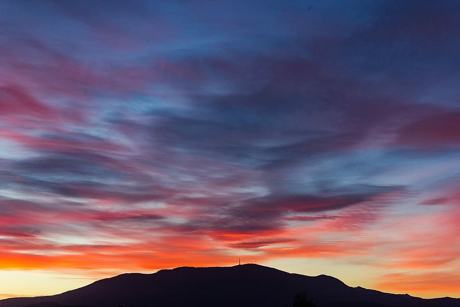 silhouette of mountain at sunset, silhouette photography of hill under calm sky HD wallpaper