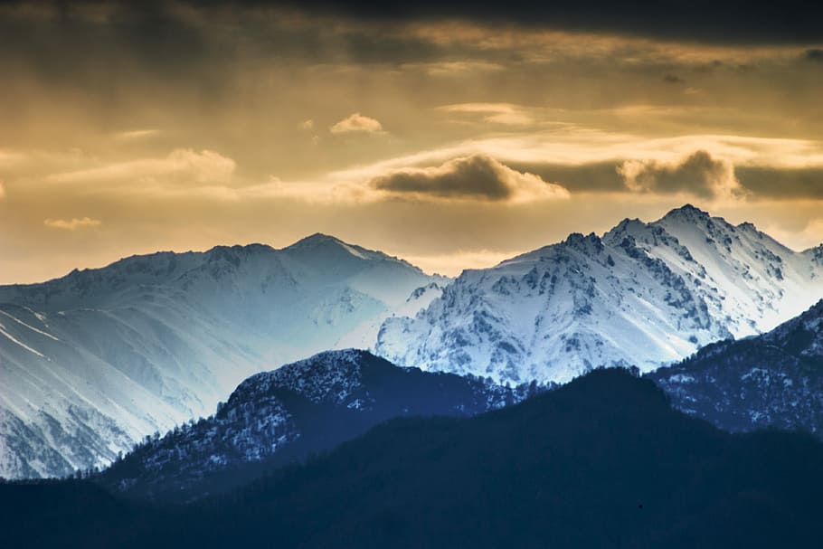 blue and white mountains screengrab, gray mountain under cloudy sky HD wallpaper
