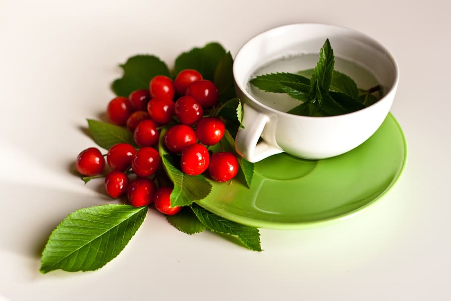 green hear near red fruit and white ceramic cup, mint, tee HD wallpaper