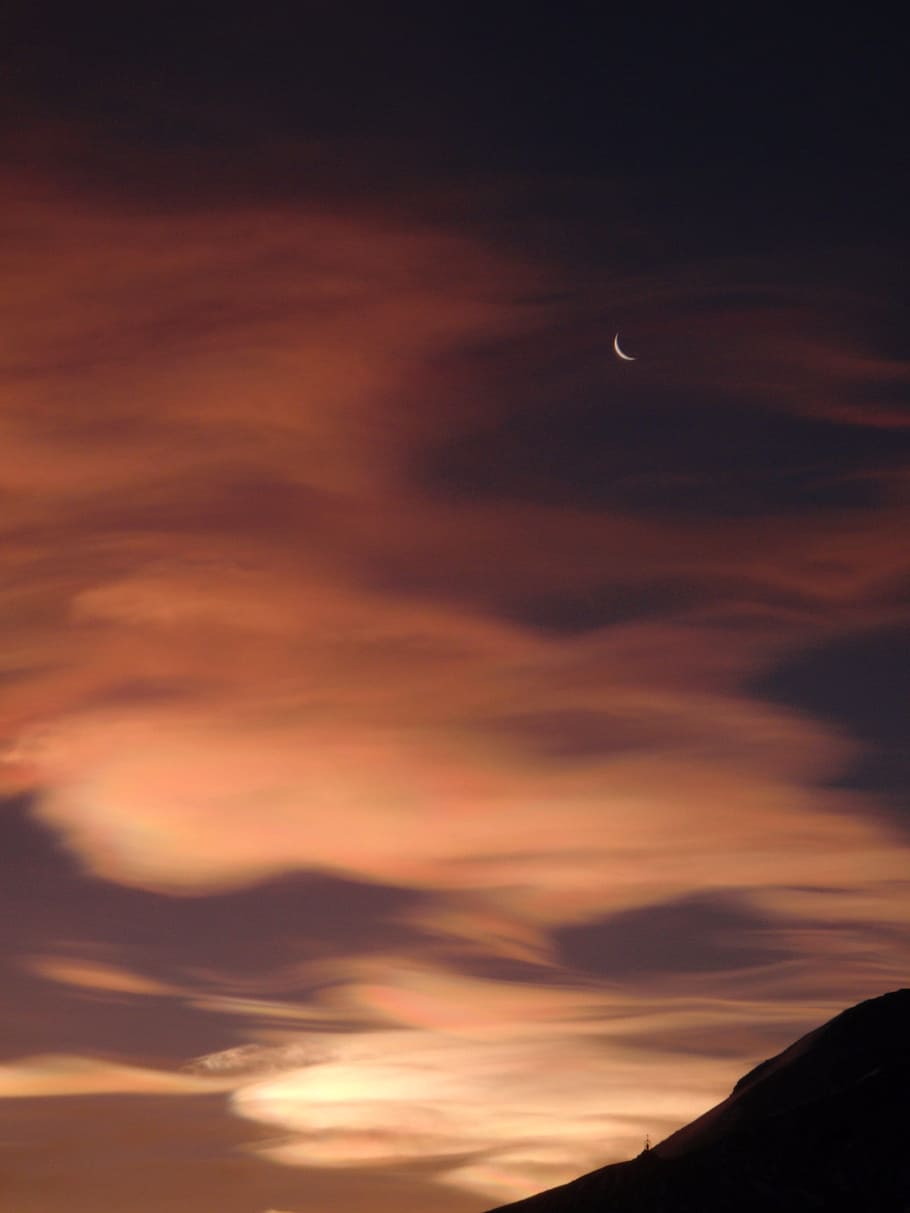 silhouette of mountain under white clouds with crescent moon during sundown HD wallpaper