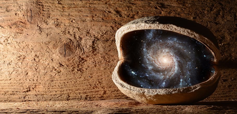 gray stone with galaxy photo, nut, walnut, universe, the universe in the nut shell