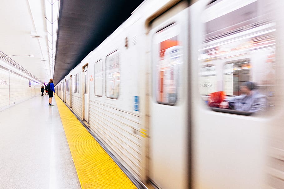 selective focus photography of person standing on train station, people standing in subway at daytime HD wallpaper