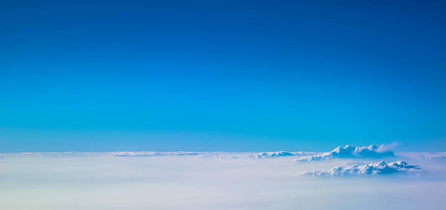 mountain alps under cumulus clouds, blue sky, above the clouds HD wallpaper