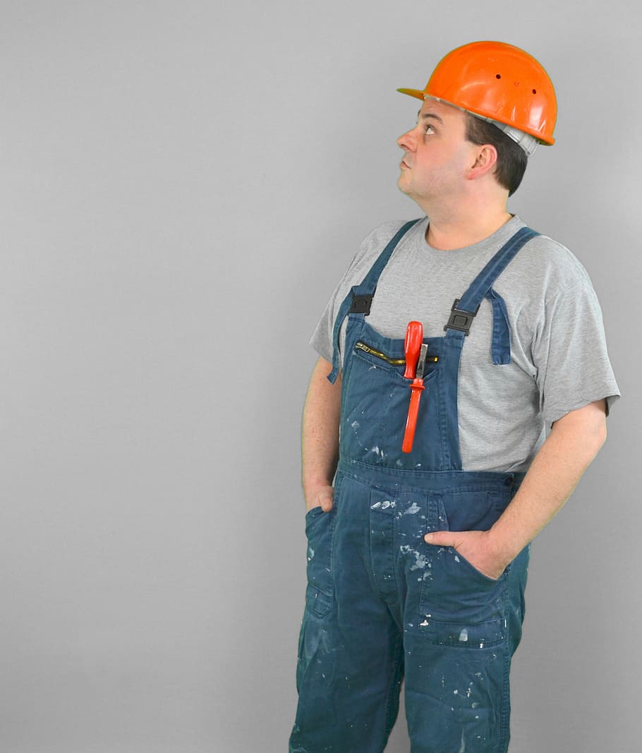 man wearing blue overalls and orange hard hat, workers, construction workers