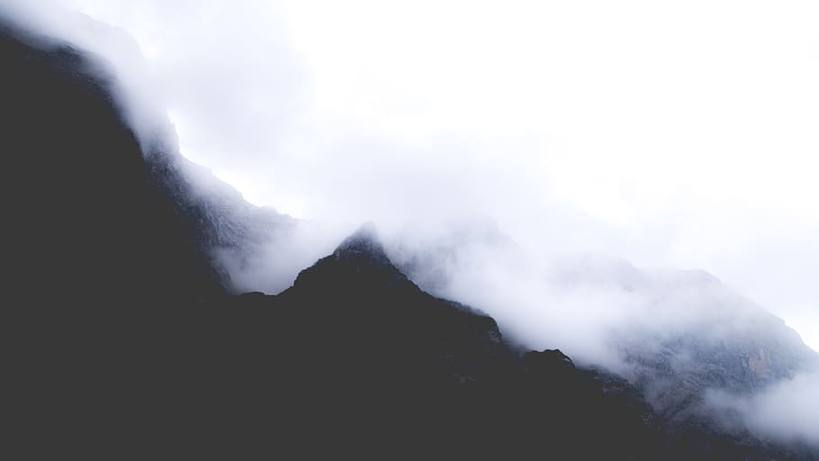 silhouette of mountain covered with fogs at daytime, mountain in mist HD wallpaper