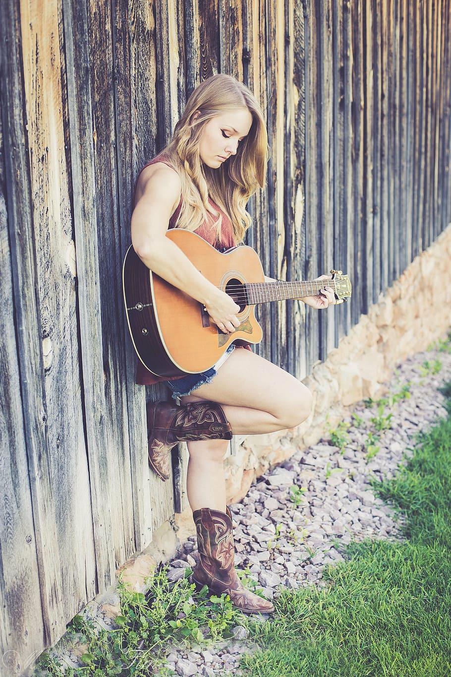 woman wearing brown sleeveless top playing guitar during daytime, HD wallpaper